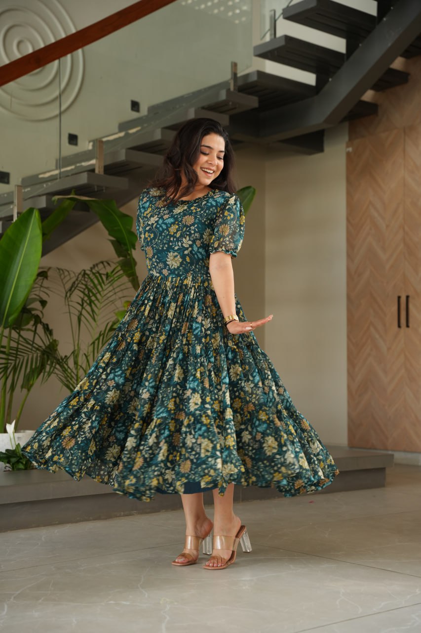 Vikarni Green Printed Anarkali Gown in faux georgette with 12-meter flair – perfect ethnic wear for women, long gown for women, printed gown for girls, Anarkali gown for wedding, georgette gown for festive wear, Indian dress for women, traditional wear for haldi ceremony, party wear gown online, readymade gown under 1000, stylish green ethnic gown for mehndi function.